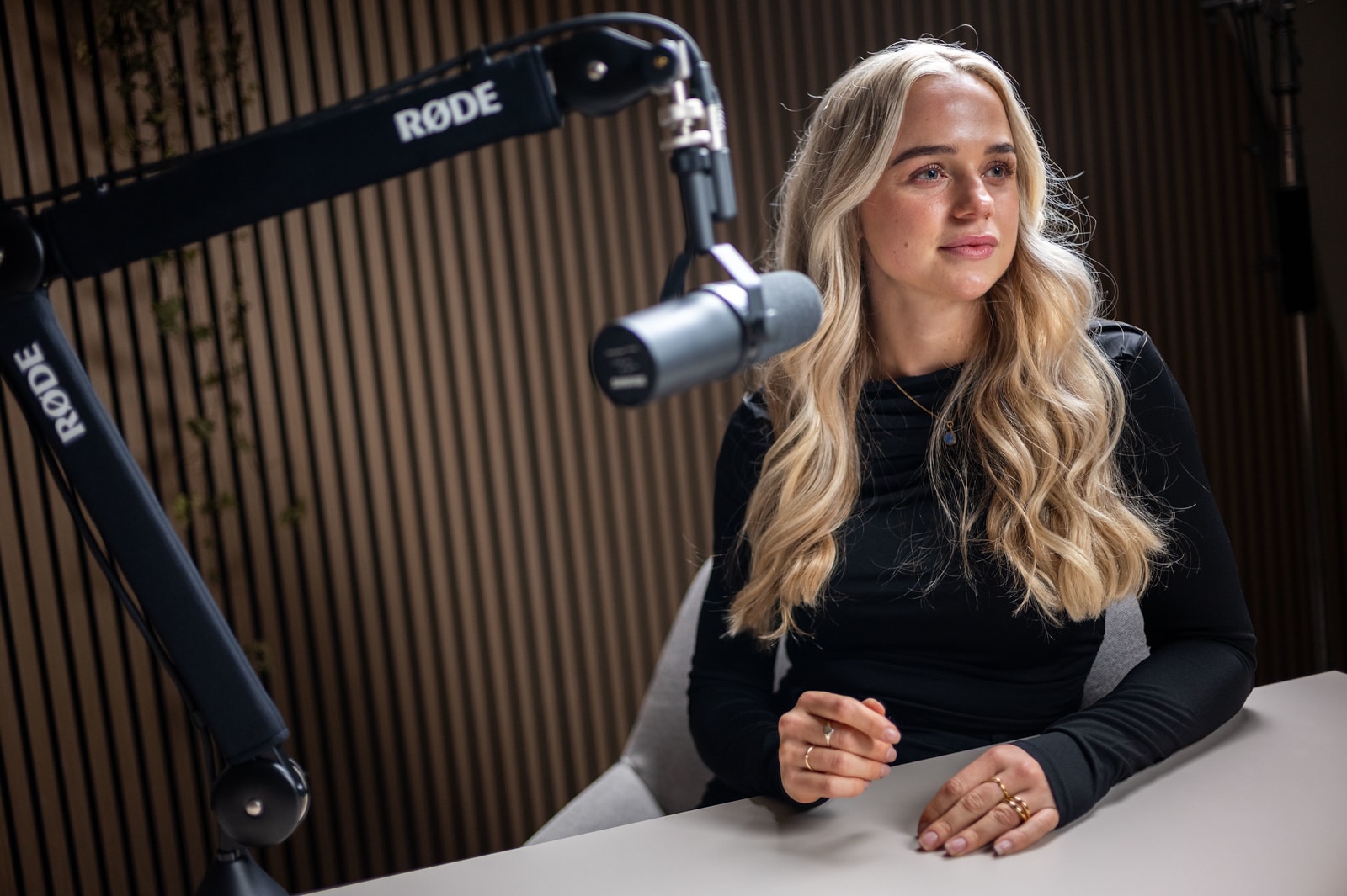 Anouk recording at a microphone